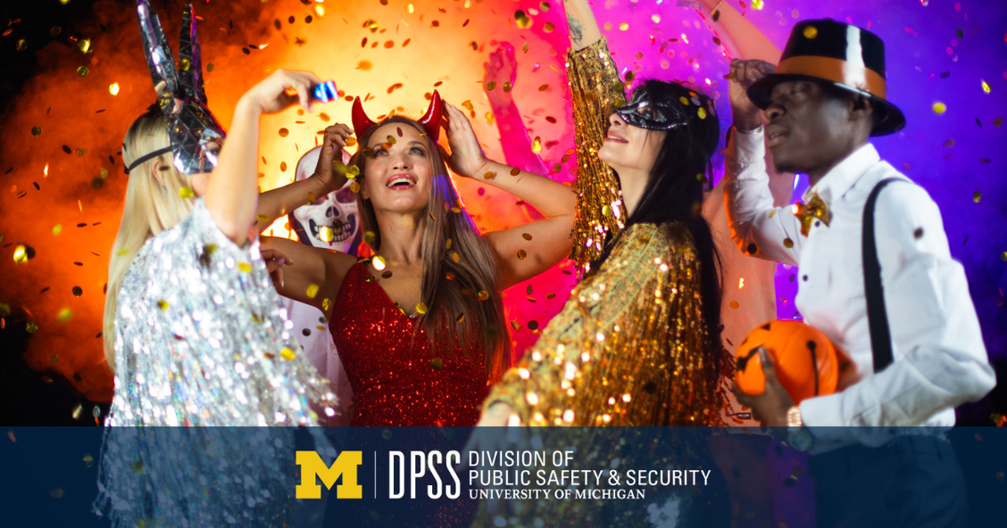 Halloween partygoers laughing.