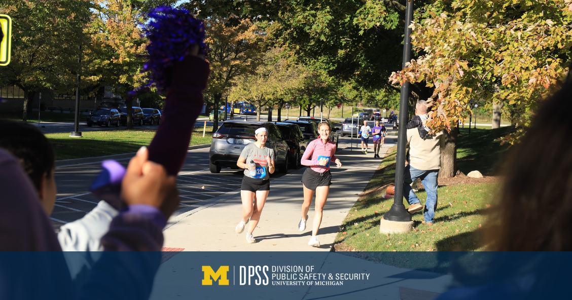 Image of two people running.