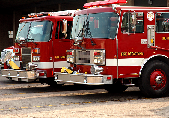 Photo of two parked fire trucks.