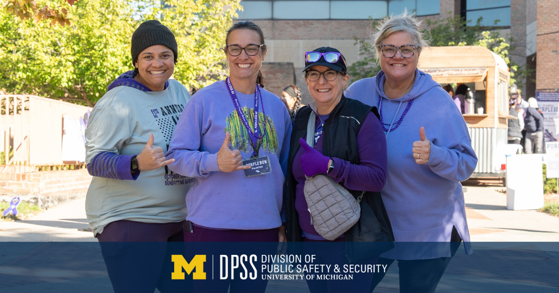 The SVU team at the Purple Run, posing with thumbs up.